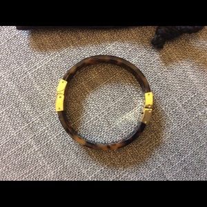Michael Kors tortoise shell bracelet.